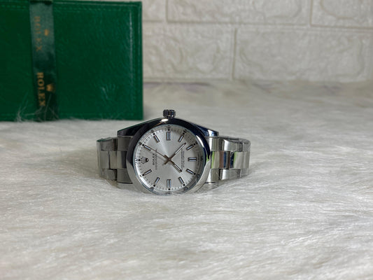 Rolex Oyster Perpetual Silver Dial – Classic Luxury Redefined